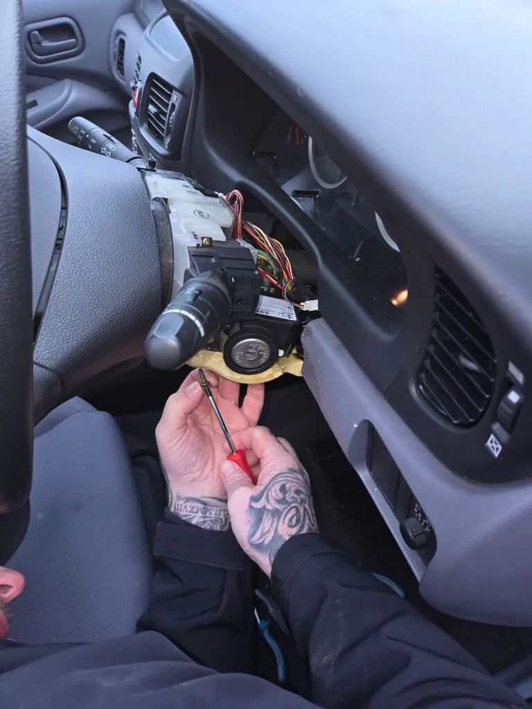 Car ignition barrel stripped down for repair by a mobile auto locksmith